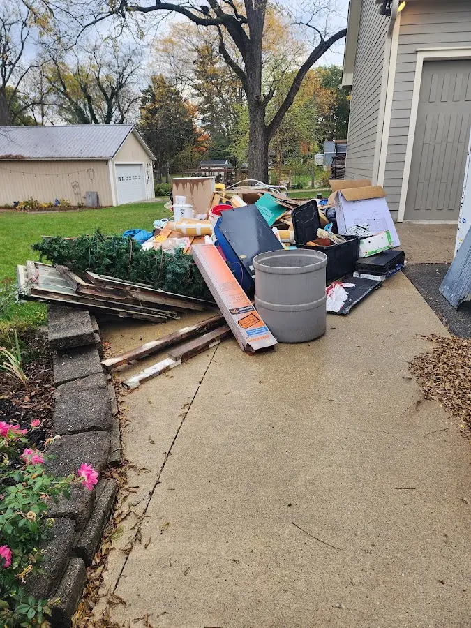 Dumpster being loaded with debris for Commercial Dumpster Rental in Henderson